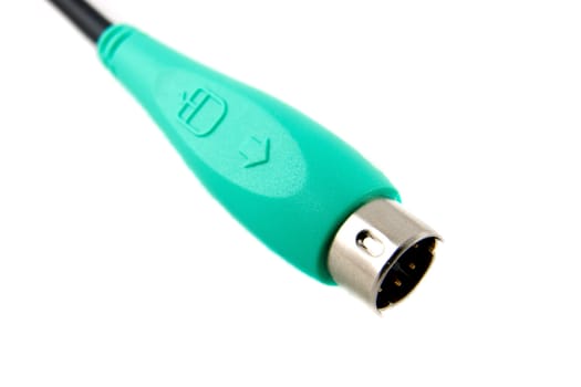 Closeup of a green connector for connecting a PC mouse to a computer.