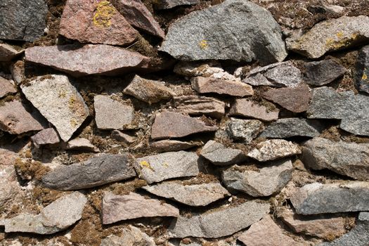 Rock Wall.Close up of a Stacked Stone Facade Background 
