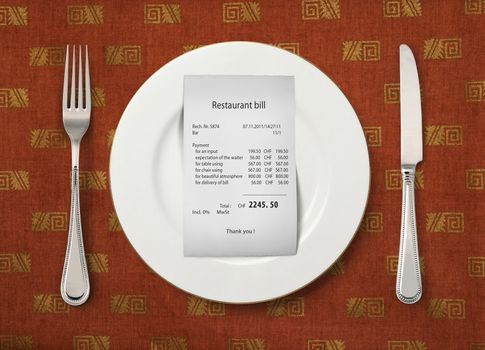 The bill on empty plate at restaurant