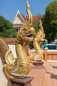 Thai golden dragon guards the entrance to the temple.