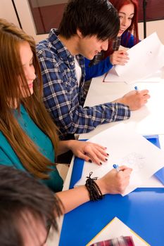 HIgh angle take of students at a desk