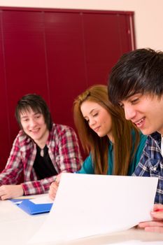 Students inside the classroom at work