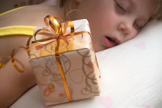 An image of girl with box with present