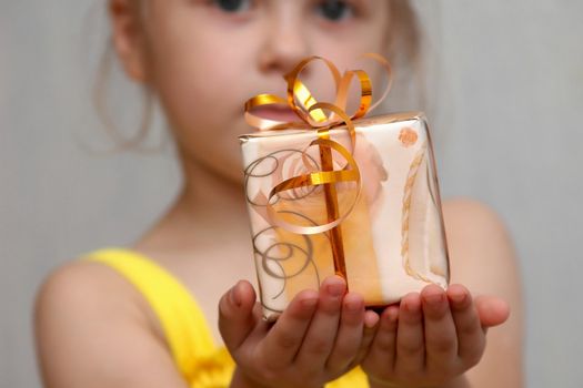An image of girl with present in box