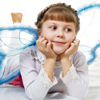 Stock photo: an image of a little girl dressed like blue butterfly