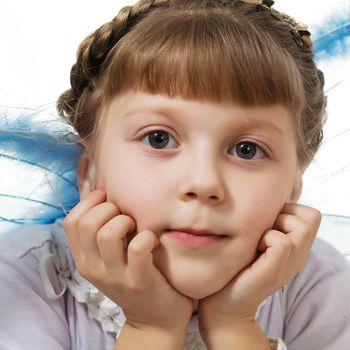 Stock photo: an image of a little girl with blue wings