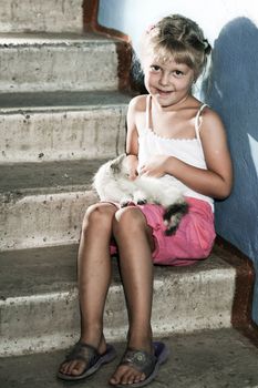 Friends. Smiling girl with a kitten in her arms