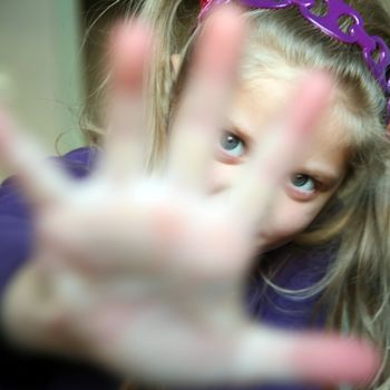 An image of a girl showing her hand
