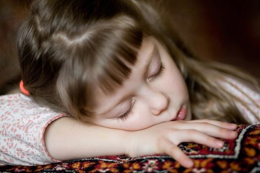 Stock photo: an image of a beautiful  girl on a sofa having sweet dreams