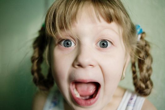 Stock photo: an image of a  little girl with her mouth open