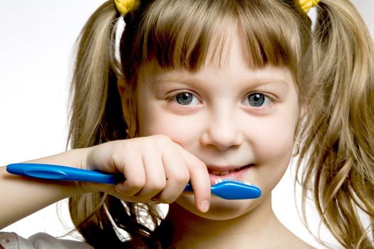 Stock photo: an image of a girl with toothbrush