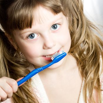 Stock photo: an image of a girl cleaning her teeth