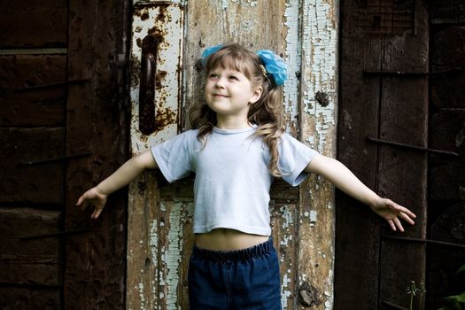 An image of girl at old door