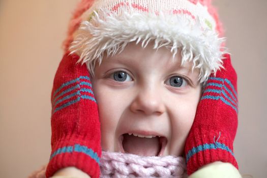 An image of a nice girl in red mittens