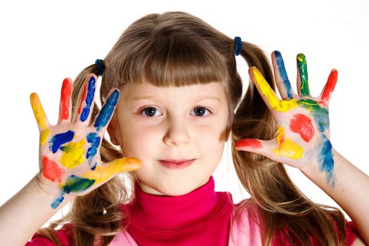 Stock photo: an image of a girl with her hands in paint