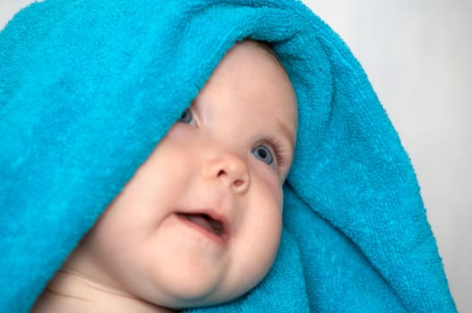 An image of baby in a towel