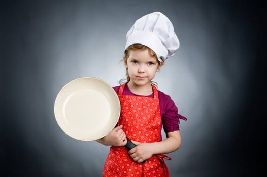 An image of a girl in white hat with frying pan