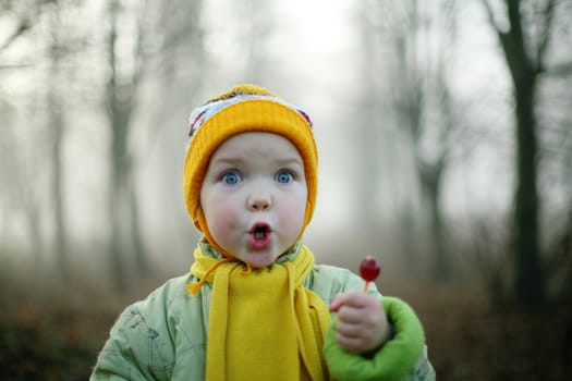 An image of a nice girl with a candy