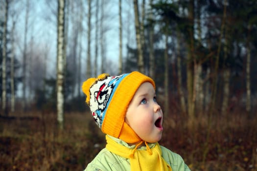 An image of a surprised girl in the park
