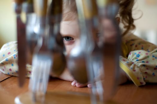 An image of a cute little girl in the kitchen