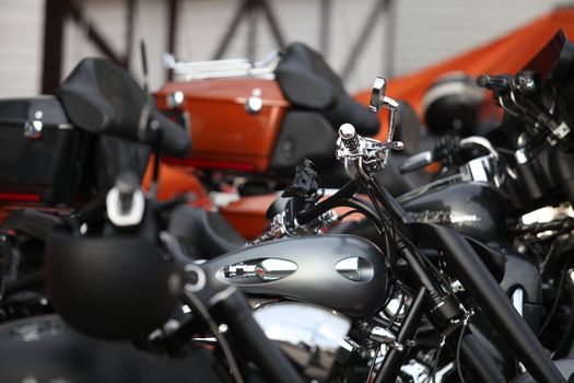 Many modern motorcycles on parking