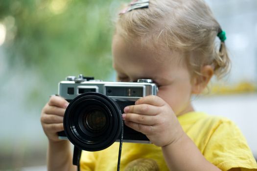 A beautiful little girl with a camera