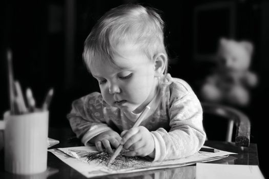 A girl with pencil drawing a picture