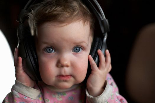 An image of child listening to music