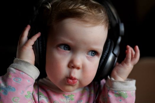 An image of child listening to music