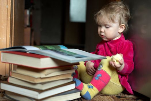 An image of child reading books.