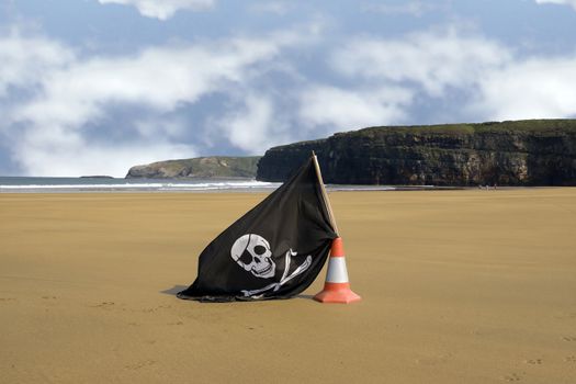 sandy golden beach with jolly roger flag in ballybunion county Kerry Ireland