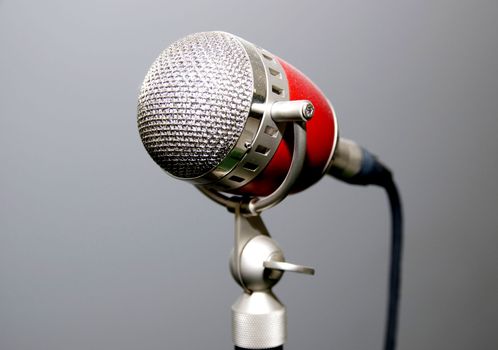 old microphone for singer with a gray background