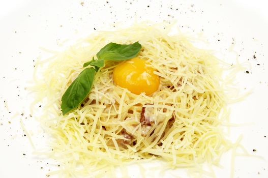 spaghetti with egg and cheese on white plate