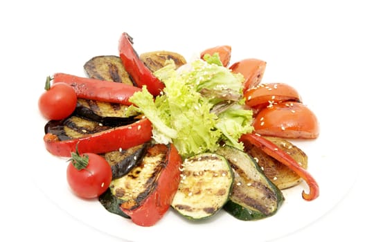 grilled vegetables and greens on a white background