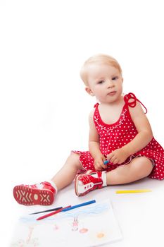 Pretty baby girl with pencils and album over white