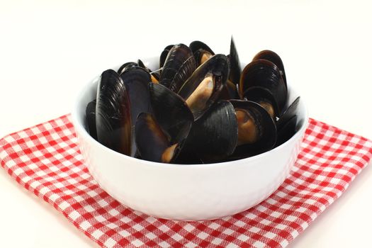 fresh mussels cooked in a white bowl