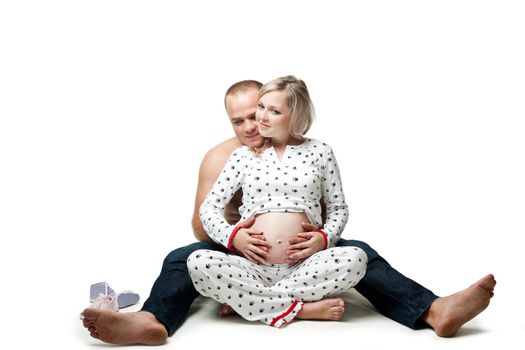 An image of a pregnant woman and her husband