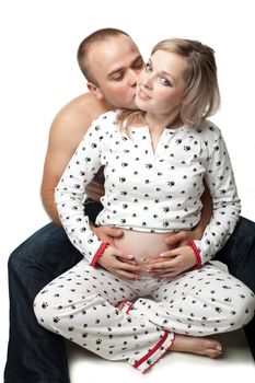 An image of a pregnant woman and her husband