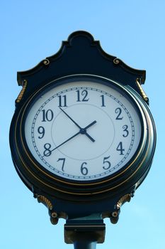 Old vintage clock with blue sky