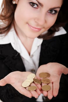 A smiling girl with coins on her palms