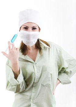 An image of nurse in a mask with an injection