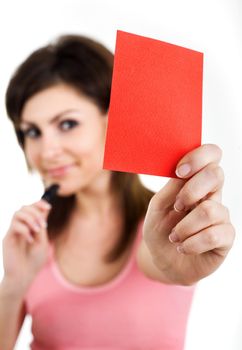 An image of a woman showing red card