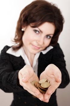 A nice girl showing coins on her palms