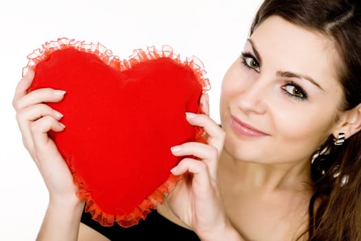 Stock photo: an image of a girl with a red heart in her hands
