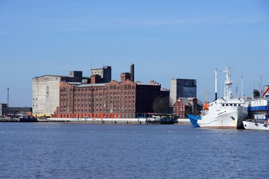 Industrial building on a background of water and the sky