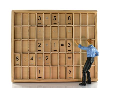 teacher with wooden education board