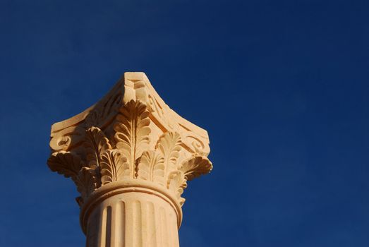 column with blue sky behind