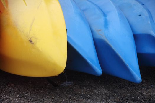 blue and yellow rental boats near a lake