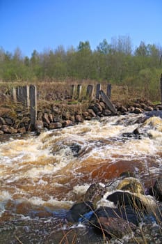 river flow on old destroyed dam