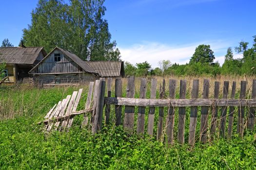 old fence near rural wooden building